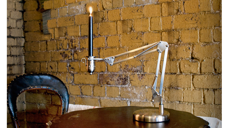 Illustration for article titled Is This Articulating Candle Holder the Grandfather of the Famous Pixar Desk Lamp?
